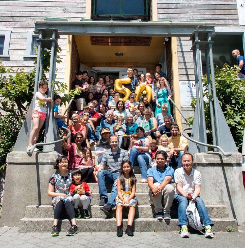 The congregation gathered on the Webb Street steps holding gold 5 and 0 balloons for the church’s 50th anniversary.